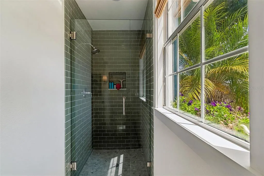 Custom green tile walk-in shower remodel in Tampa Bay