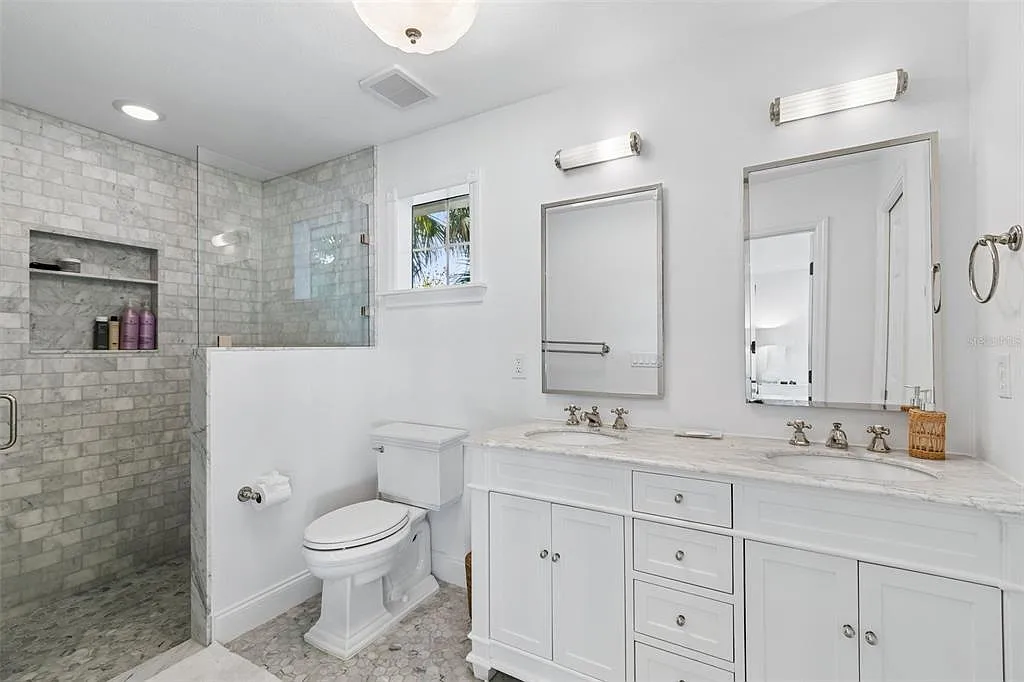Modern marble primary bathroom remodel in Hyde Park South Tampa by FLDCS